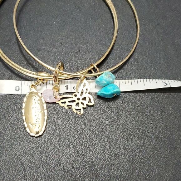 Gold tone layered bracelet with charms - Picture 7 of 9